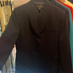 Navy lined pants suit. Worn twice freshly dry Cleaned.